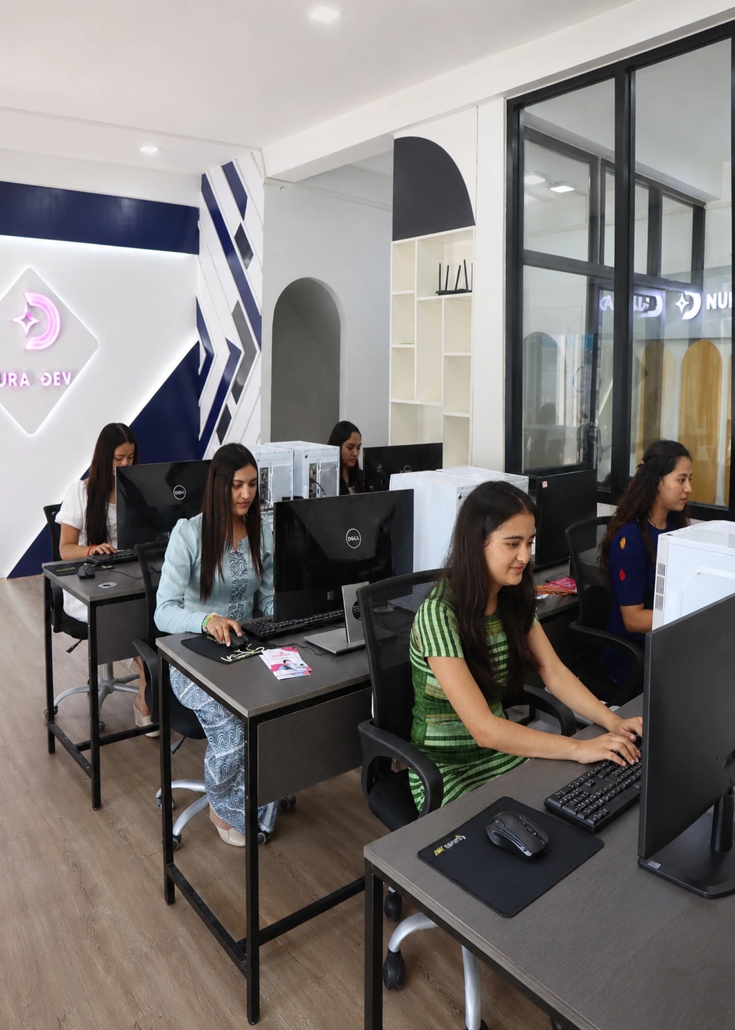 Nura Dev students practicing computer skills in the coding classroom