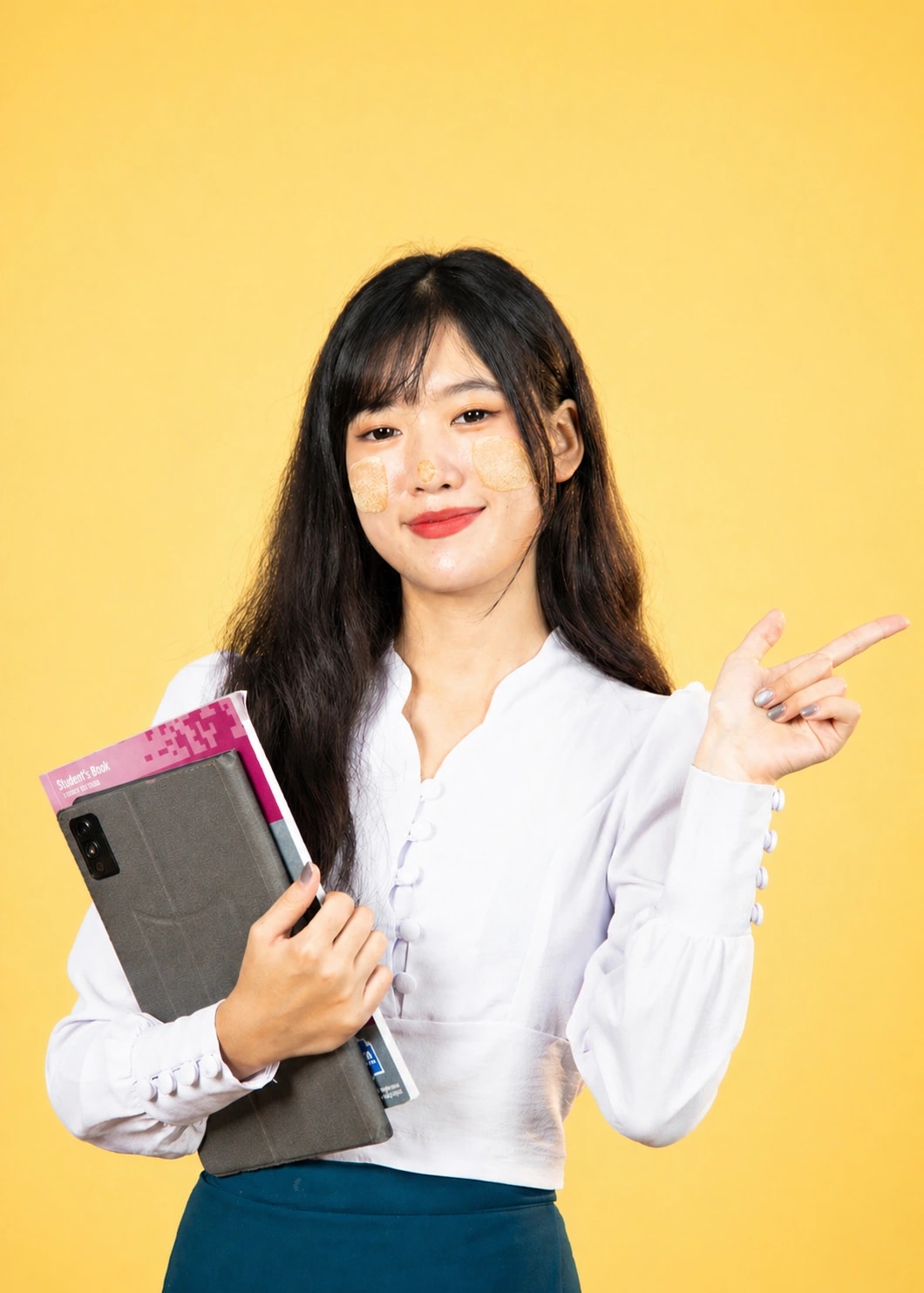 Nura Dev learner holding study materials for computer and coding training