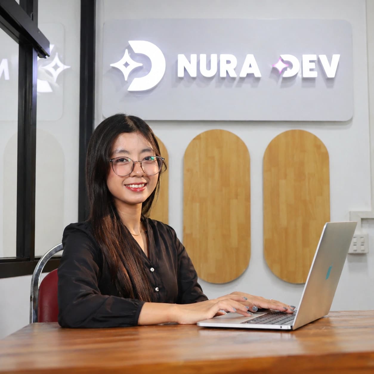 Nura Dev student practicing laptop skills at the campus